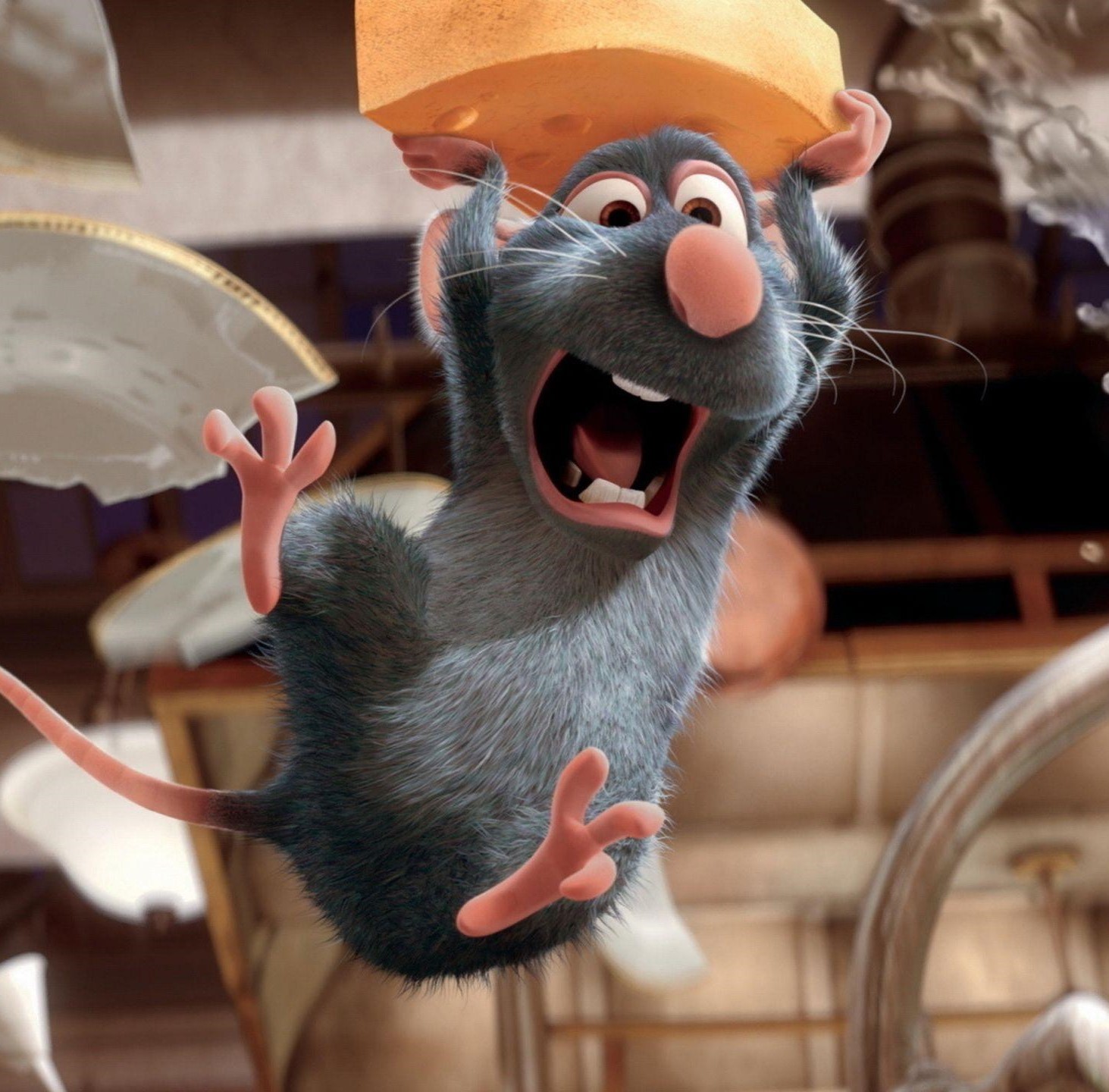 A still from the film Ratatouille, showing a cute rat in mid-air